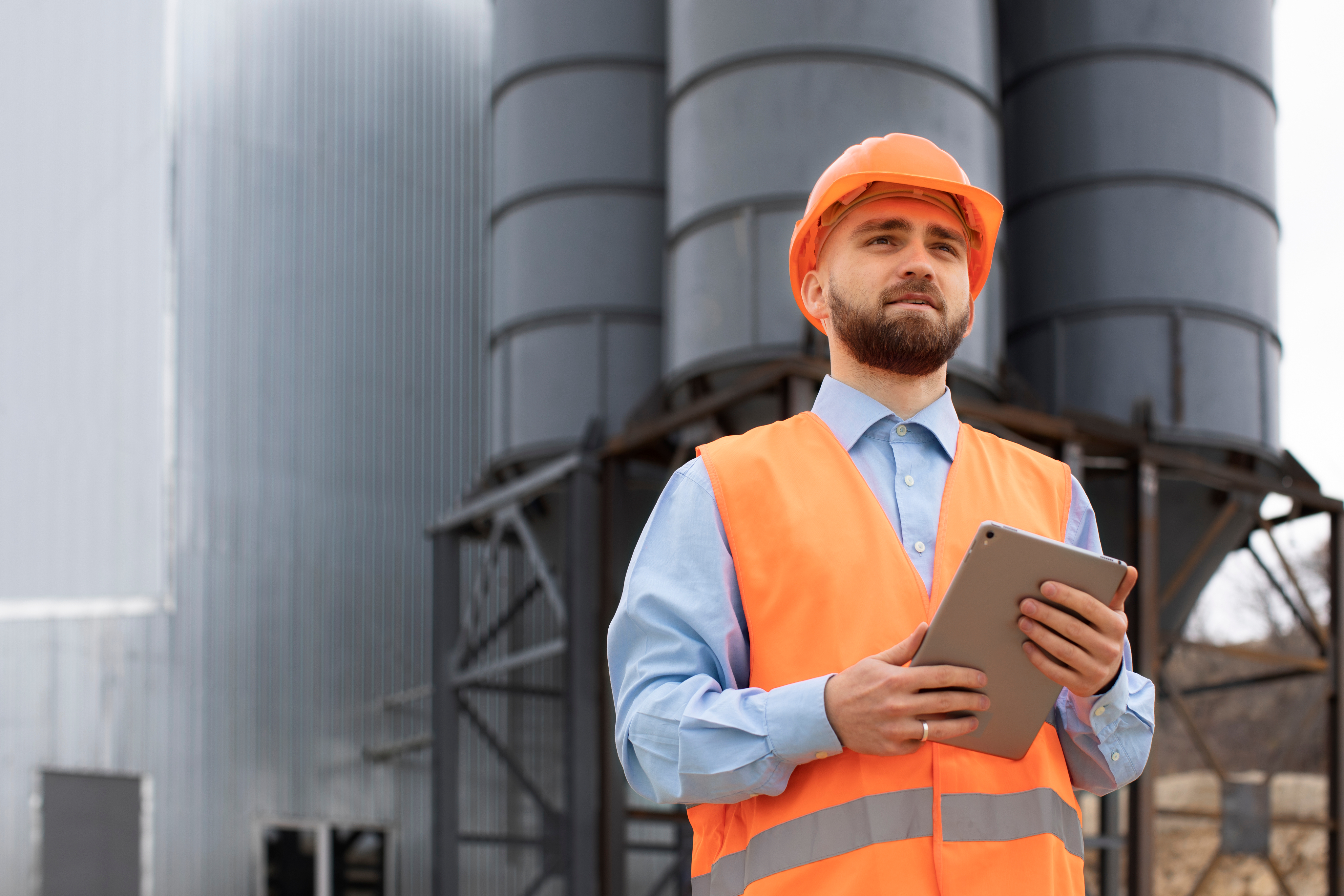 Engineer with tablet at industrial facility