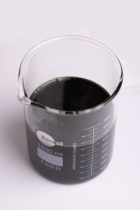 Furnace oil sample in a laboratory beaker